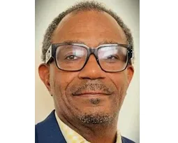 Professional headshot of a business executive in glasses, suitable for food service industry leadership and B2B wholesale distribution.