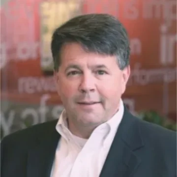 Professional headshot of a business executive in formal attire, ideal for food supply and wholesale distribution industry leadership.